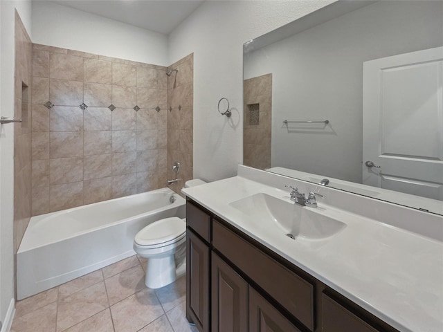 bathroom featuring  shower combination, vanity, toilet, and tile patterned floors