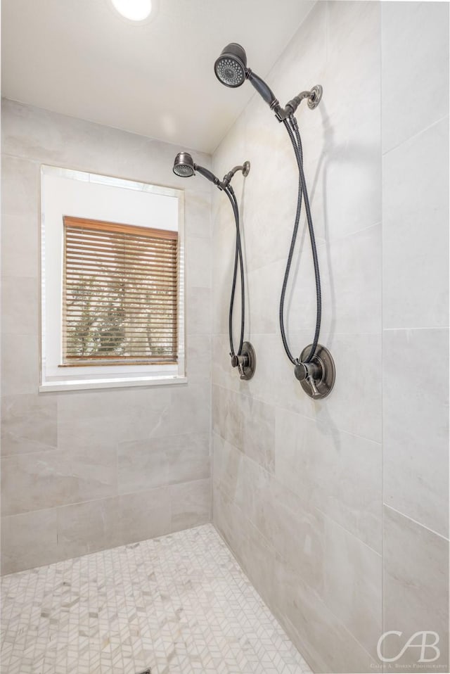 full bath featuring a tile shower