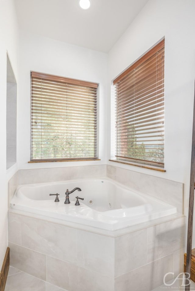 full bath featuring a tub with jets