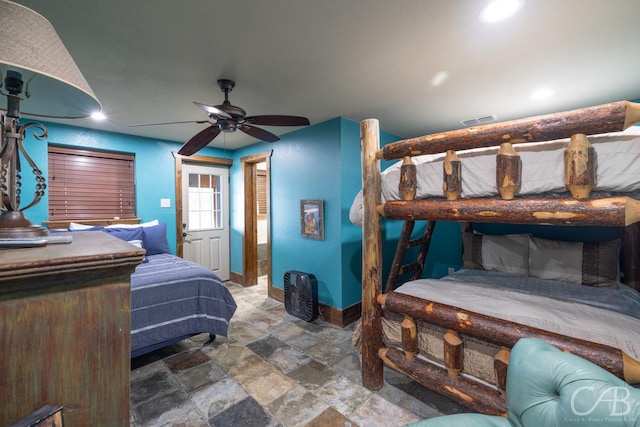 bedroom with ceiling fan, recessed lighting, visible vents, baseboards, and stone finish flooring