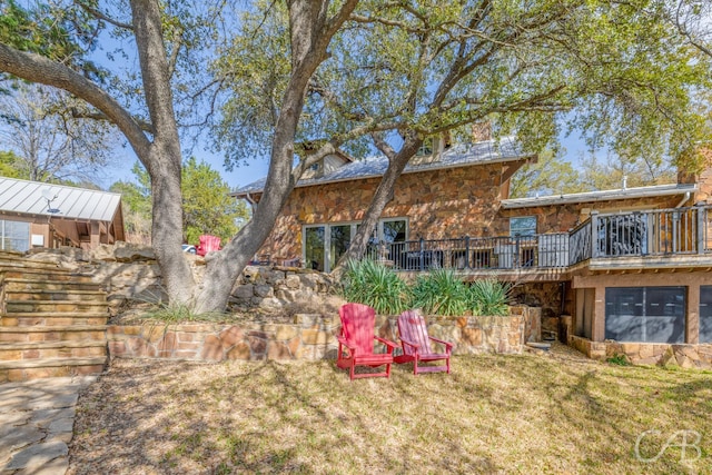 view of yard with a wooden deck and stairs