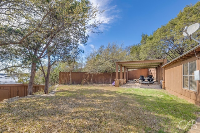 view of yard featuring a fenced backyard and a patio