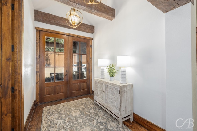 foyer entrance with vaulted ceiling with beams, french doors, wood finished floors, and baseboards