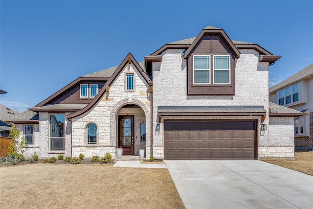 view of front of home featuring a garage, brick siding, driveway, and a shingled roof