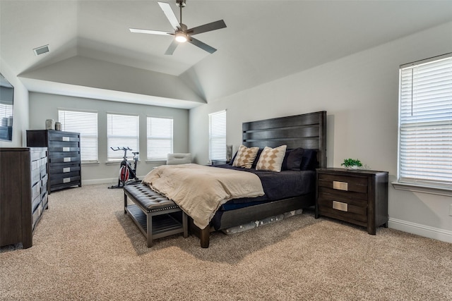 bedroom with baseboards, visible vents, light carpet, and lofted ceiling