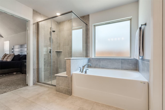 full bath with tile patterned floors, a stall shower, and a bath