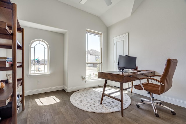 office space with wood finished floors, a healthy amount of sunlight, baseboards, and lofted ceiling