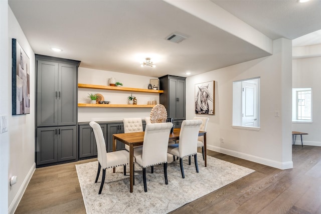 dining space featuring recessed lighting, visible vents, baseboards, and wood finished floors