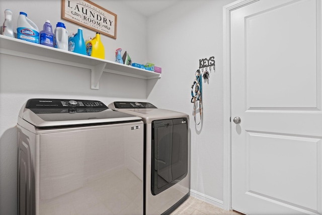 laundry area with laundry area, light tile patterned floors, and separate washer and dryer