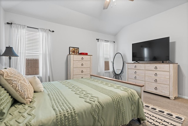 bedroom featuring lofted ceiling, light carpet, and ceiling fan