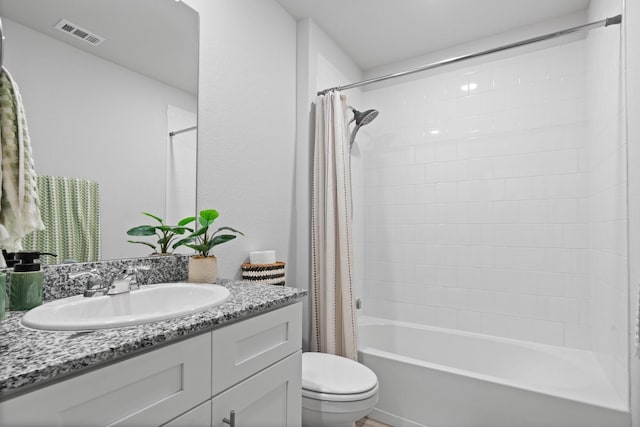 bathroom featuring toilet, visible vents, shower / tub combo with curtain, and vanity