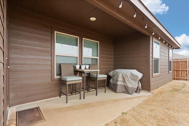 view of patio / terrace featuring fence and grilling area