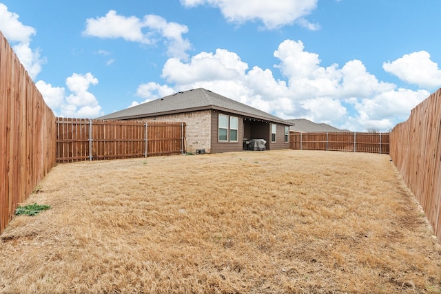 view of yard featuring a fenced backyard