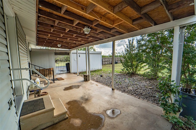 view of patio / terrace featuring fence