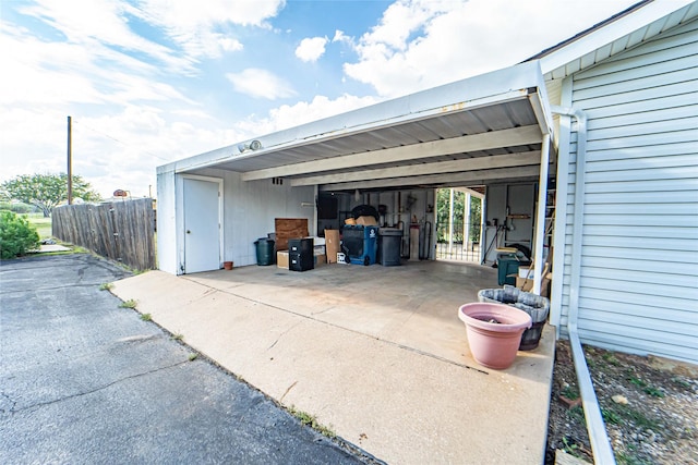 exterior space featuring driveway and an attached carport