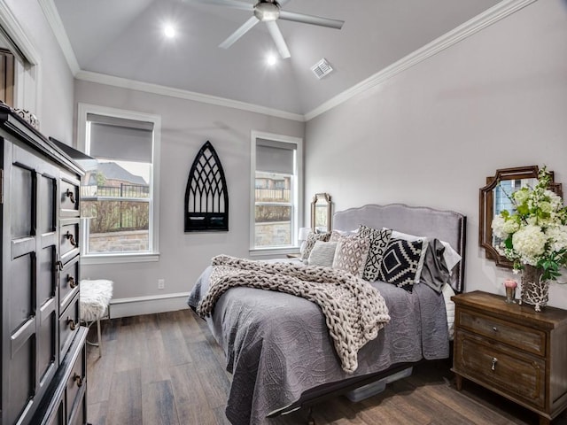 bedroom featuring dark wood-style floors, crown molding, visible vents, vaulted ceiling, and ceiling fan