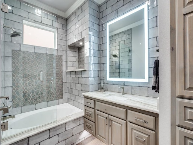 full bathroom featuring tile walls, crown molding, vanity, and decorative backsplash