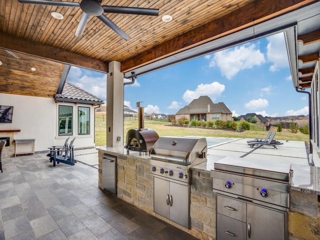 view of patio featuring a grill, a ceiling fan, and area for grilling