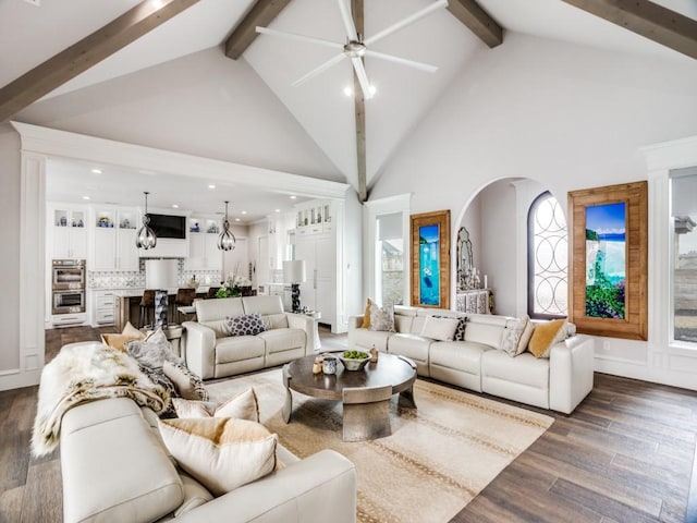 living room with a notable chandelier, recessed lighting, wood finished floors, high vaulted ceiling, and beamed ceiling