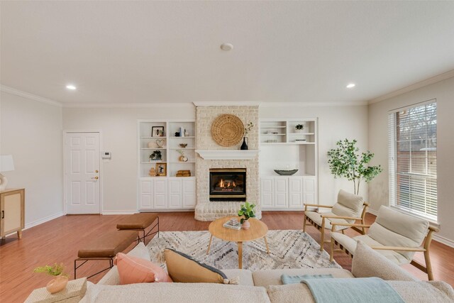 living area with baseboards, recessed lighting, wood finished floors, and ornamental molding