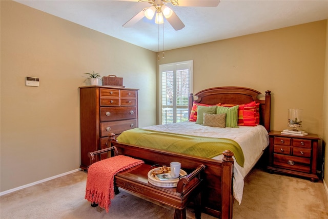 bedroom featuring light carpet, ceiling fan, and baseboards