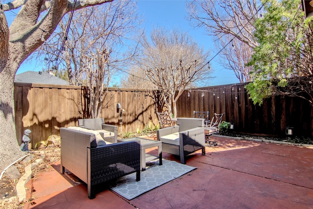 view of patio with a fenced backyard and an outdoor living space