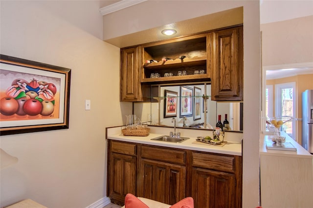 bar with wet bar and a sink