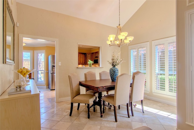 dining room featuring light tile patterned floors, high vaulted ceiling, baseboards, ornamental molding, and an inviting chandelier