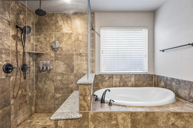 bathroom with a tile shower and a bath