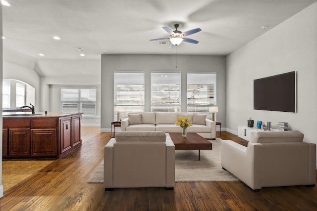 living room with recessed lighting, visible vents, a ceiling fan, wood finished floors, and baseboards