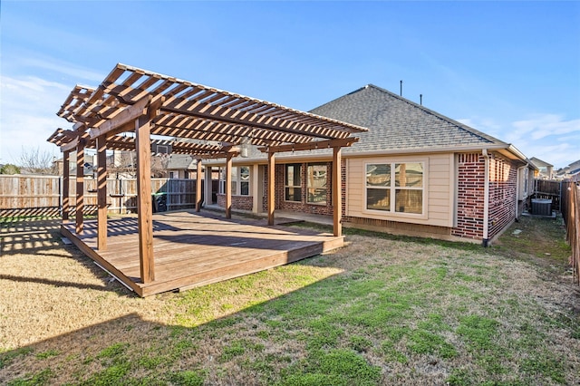 rear view of property featuring a lawn, a fenced backyard, cooling unit, a pergola, and brick siding