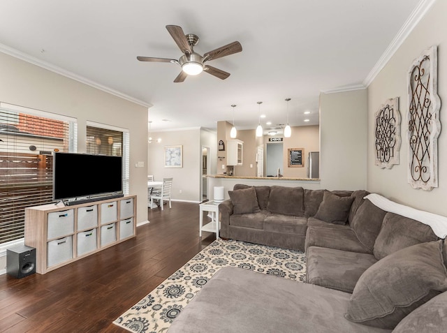 living area with crown molding, dark wood finished floors, baseboards, and ceiling fan