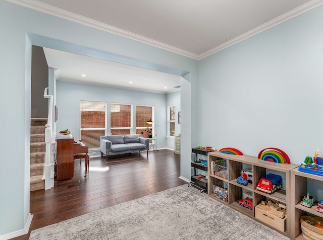 game room with baseboards, ornamental molding, wood finished floors, and recessed lighting