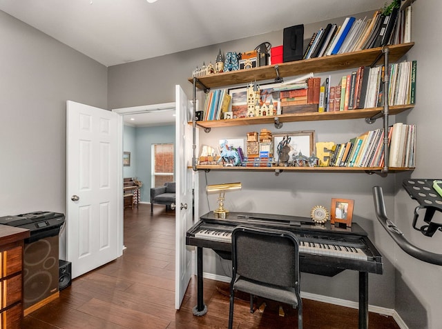 office area featuring baseboards and wood finished floors