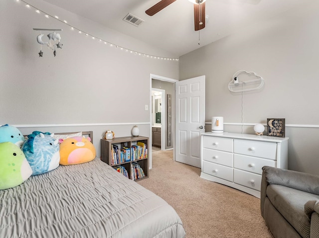 bedroom with light carpet, ceiling fan, vaulted ceiling, and visible vents