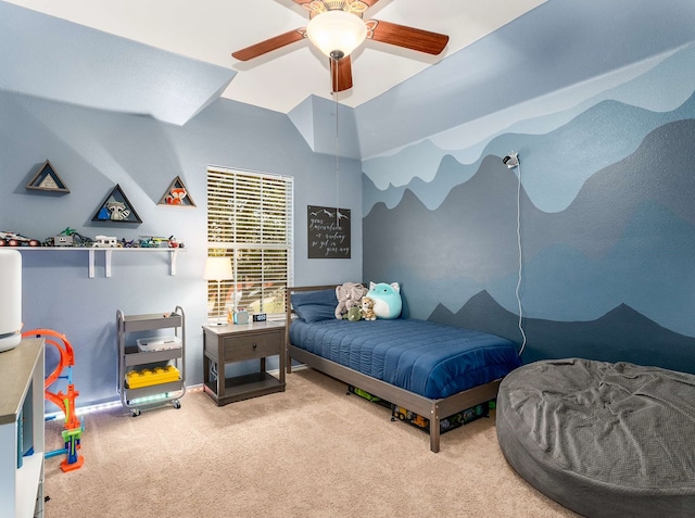 carpeted bedroom featuring lofted ceiling and a ceiling fan