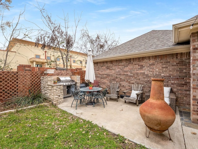 view of patio featuring a grill