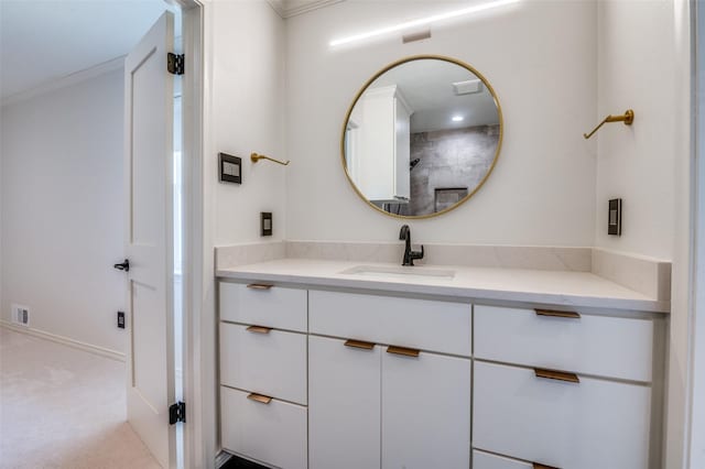 bathroom with visible vents, ornamental molding, and vanity