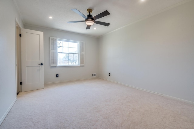 unfurnished room featuring recessed lighting, light colored carpet, crown molding, and baseboards