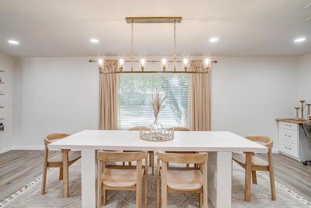 dining space with recessed lighting, light wood-style flooring, and baseboards