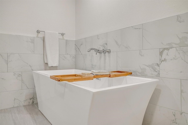 bathroom with tile walls