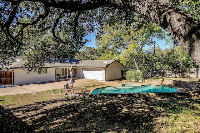 exterior space featuring a patio area, a fenced backyard, and a fenced in pool