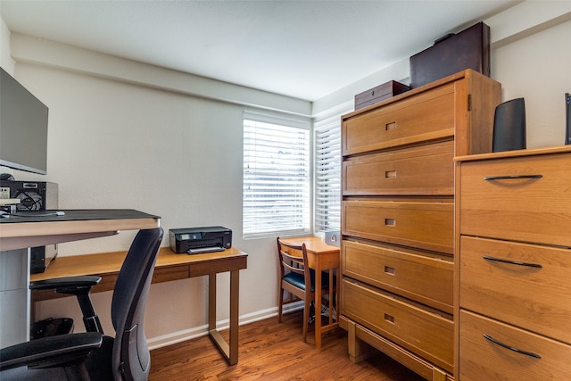 office with baseboards and wood finished floors