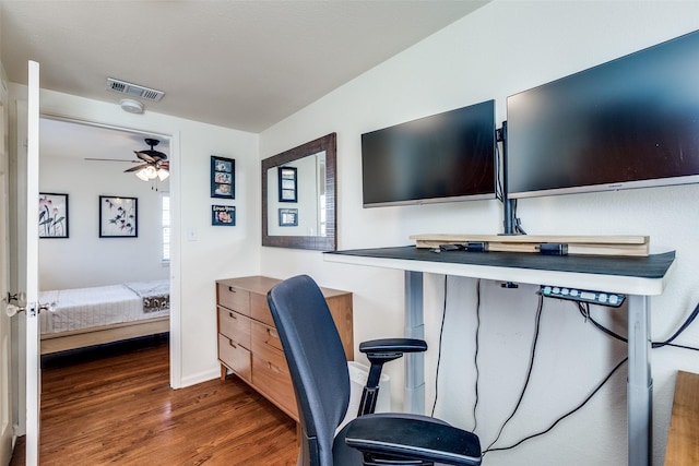 office area with baseboards, ceiling fan, visible vents, and wood finished floors