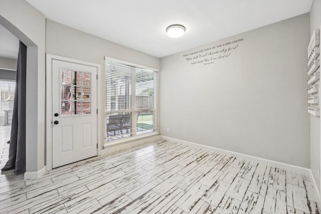 empty room featuring baseboards