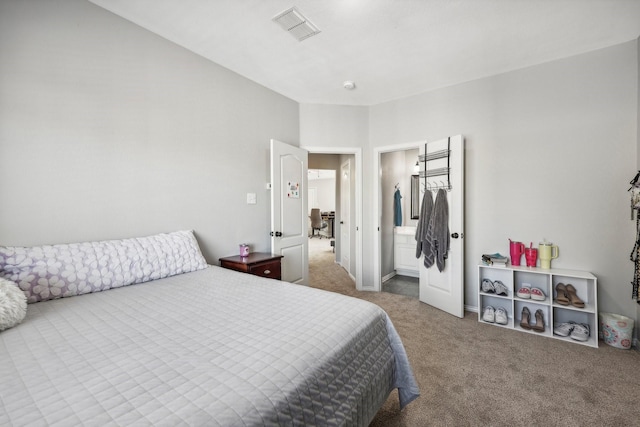 carpeted bedroom with visible vents