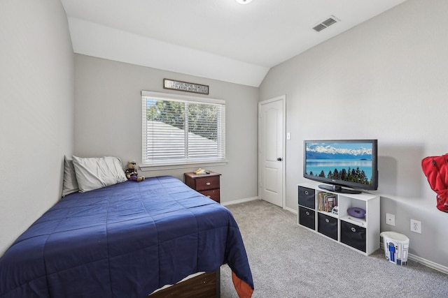 carpeted bedroom featuring baseboards, visible vents, and vaulted ceiling