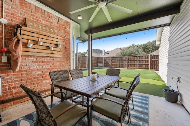 view of patio / terrace featuring ceiling fan, outdoor dining area, and a fenced backyard