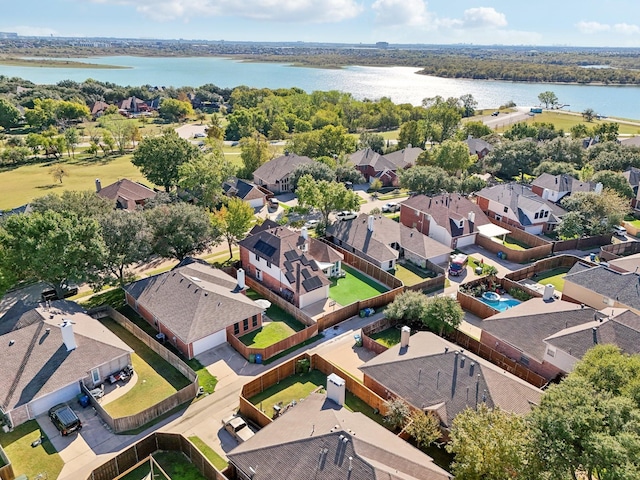 birds eye view of property featuring a water view and a residential view