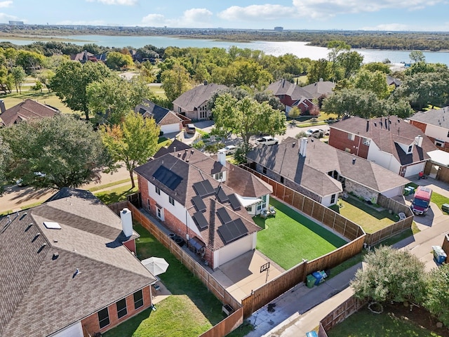 bird's eye view featuring a water view and a residential view